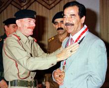 Iraq's vice-Chairman of the Revolution Command Council, Ezzat Ibrahim al-Douri, gives an award to President Saddam Hussein (R) in Baghdad in an undated file photo. PHOTO BY REUTERS/Stringer