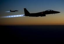A pair of U.S. Air Force F-15E Strike Eagles fly over northern Iraq after conducting airstrikes in Syria, in this U.S. Air Force handout photo taken early in the morning of September 23, 2014. PHOTO BY REUTERS/U.S. Air Force