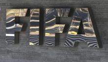 The FIFA logo is seen at the FIFA headquarters in Zurich, Switzerland, March 18, 2016. PHOTO BY REUTERS/Ruben Sprich