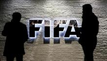 Journalists gather in front of FIFA's headquarters in Zurich, Switzerland, December 2, 2015. PHOTO BY REUTERS/Arnd Wiegmann