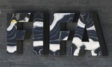 The FIFA logo is seen at the FIFA headquarters in Zurich, Switzerland, March 18, 2016. PHOTO BY REUTERS/Ruben Sprich