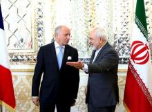 French foreign minister Laurent Fabius (L) and his Iranian counterpart Mohammad Javad Zarif arrive for a meeting in Tehran, July 29, 2015. PHOTO BY REUTERS/Raheb Homavandi