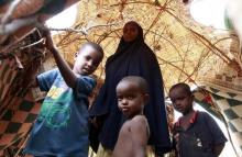 An internally displaced family stands inside their makeshift shelter structure at the Qansahaley settlement camp in Dollow town along the Somalia-Ethiopia border, August 30, 2011. PHOTO BY REUTERS/Thomas Mukoya