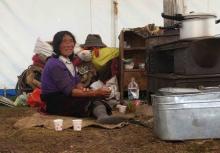 A Tibetan herdsman rests at her tent in Aba Tibetan and Quango Autonomous Prefecture, Sichuan province, August 1, 2015. PHOTO BY REUTERS/Natalie Thomas