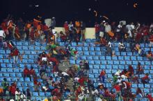 Equatorial Guinea fans react as a police helicopter hovers above the stand during the 2015 African Cup of Nations semi-final soccer match against Ghana in Malabo, February 5, 2015. PHOTO BY  REUTERS/Amr Abdallah Dalsh