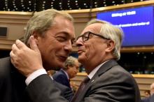 European Commission President Jean-Claude Juncker welcomes Nigel Farage, the leader of the United Kingdom Independence Party, prior to a plenary session at the European Parliament on the outcome of the "Brexit" in Brussels, Belgium, June 28, 2016. PHOTO BY REUTERS/Eric Vidal