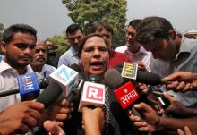 Farha Faiz, a lawyer, speaks with the media after a verdict for the controversial Muslim quick divorce law outside the Supreme Court in New Delhi, India, August 22, 2017. PHOTO BY REUTERS/Adnan Abidi