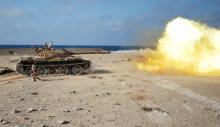A fighter of Libyan forces allied with the U.N.-backed government fires a shell with Soviet made T-55 tank at Islamic State fighters in Sirte, Libya, August 2, 2016. PHOTO BY REUTERS/Goran Tomasevic