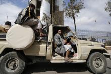 Shi'ite Houthi fighters ride a truck outside the house of Sunni tribal leader, Sheikh Sadiq al-Ahmar in Sanaa, November 26, 2014. PHOTO BY REUTERS/Khaled Abdullah