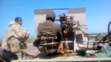 Members of UAE-backed fighters, Yemeni Resistance Giants' Brigade sit with the gun at the back of truck, near airport on the outskirts of Hodeidah, Yemen, June 19, 2018 in this still image taken from video. PHOTO BY REUTERS/YEMENI RESISTANCE GIANTS' BRIGADE