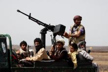 Houthi fighters ride on the back of a patrol truck as they secure the site of a pro-Houthi tribal gathering in a rural area near Sanaa, Yemen, July 21, 2016. PHOTO BY REUTERS/Khaled Abdullah