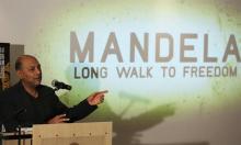 Film producer Anant Singh gestures during the launch of the movie trailer of "Mandela: Long Walk to Freedom" at the Nelson Mandela Centre of Memory in Johannesburg