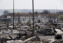The devastated neighbourhood of Abasand is shown after being ravaged by a wildfire in Fort McMurray, Alberta, Canada, May 13, 2016. PHOTO BY REUTERS/Jason Franson