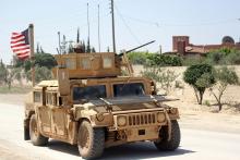 The U.S. flag flutters on a military vehicle in Manbej countryside, Syria, May 12, 2018. PHOTO BY REUTERS/Aboud Hamam