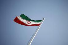 An Iranian national flag flutters in Tehran, April 15, 2011. PHOTO BY REUTERS/Morteza Nikoubazl