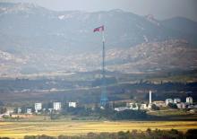 A North Korean flag is seen on top of a tower near the truce village of Panmunjom in the demilitarised zone (DMZ) separating North Korea from South Korea, about 55 km (34 miles) north of Seoul, September 25, 2013. PHOTO BY REUTERS/Lee Jae-Won