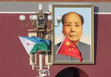 Djibouti and Chinese national flags are seen in front of the portrait of China's late Chairman Mao Zedong at Tiananmen Square, ahead of a welcoming ceremony for Djibouti's President Ismail Omar Guelleh, in Beijing, China, November 23, 2017. PHOTO BY REUTERS/Jason Lee