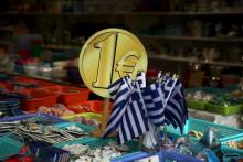 Greek flags are displayed for sale for one Euro at a shop in central in Athens, Greece, July 26, 2015. PHOTO BY REUTERS/Yiannis Kourtoglou
