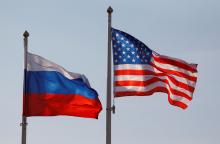 National flags of Russia and the U.S. fly at Vnukovo International Airport in Moscow, Russia April 11, 2017. REUTERS/Maxim Shemetov/