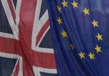 A Union flag flies next to the flag of the European Union in London, Britain, November 4, 2016. PHOTO BY REUTERS/Toby Melville