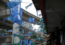 Barisan Nasional and Malaysian Islamic Party (PAS) flags hang at a public housing estate in Kuala Lumpur, Malaysia, April 20, 2018. PHOTO BY REUTERS/Stringer