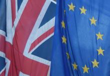 A Union flag flies next to the flag of the European Union in Westminster, London, Britain, June 24, 2016. PHOTO BY REUTERS/Toby Melville