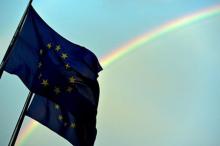 A rainbow is seen behind European flags during a euro zone EU leaders emergency summit at the European Council headquarters in Brussels, Belgium, July 7, 2015. PHOTO BY REUTERS/Eric Vidal