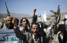 Followers of the Houthi movement shout slogans during a gathering to show support to the movement outside the Presidential Palace in Sanaa, February 4, 2015. PHOTO BY REUTERS/Khaled Abdullah