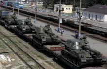 A freight car loaded with self-propelled howitzers is seen at a railway station in Kamensk-Shakhtinsky, Rostov region, near the border with Ukraine