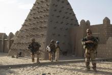 French soldiers and UN peacekeepers from Burkina Faso patrol in front of the Sankore Mosque in Timbuktu, November 5, 2014. PHOTO BY REUTERS/Joe Penney