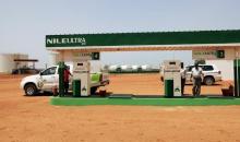 A worker fills a pickup truck's tank with blended fuel at the first blended fuel station at Kenana Sugar Company (KSC)'s main plant, 270 km (170 miles) south of Khartoum, May 14, 2013. PHOTO BY  REUTERS/Mohamed Nureldin Abdallah