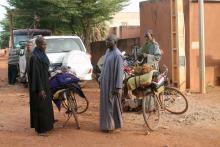 Three Fulani men sell traditional fabric on a road in Sevare, Mali, November 3, 2016. PHOTO BY REUTERS/Adama Diarra