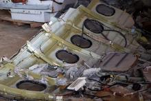 Part of the fuselage of crashed AirAsia Flight QZ8501 is seen inside a storage facility at Kumai port in Pangkalan Bun, January 19, 2015. PHOTO BY REUTERS/Beawiharta