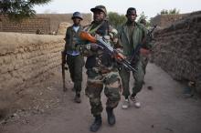 Malian soldiers patrol in the village of Kadji March 1, 2013. PHOTO BY REUTERS/Joe Penney