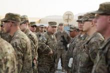 General John Francis Campbell (C), current commander of the International Security Assistance Force and United States Forces in Afghanistan, speaks to soldiers during a Christmas day visit on forward operating base Gamberi in the Laghman province of Afghanistan, December 25, 2014. PHOTO BY REUTERS/Lucas Jackson