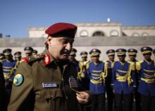 Yemen's Defence Minister Major General Muhammad Nasir Ahmad arrives at the funeral of air force officers, who were killed in a military plane crash, in Sanaa