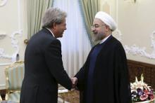Iran's President Hassan Rouhani (R) shakes hands with Italian Foreign Minister Paolo Gentiloni in Tehran August 5, 2015. PHOTO BY REUTERS