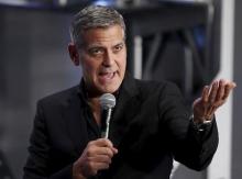 Cast member George Clooney speaks to fans during the Japan premiere of the movie "Tomorrowland" in Tokyo, May 25, 2015. PHOTO BY REUTERS/Toru Hanai