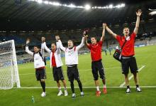 (L-R) Germany's national soccer players Roman Weidenfeller, Shkodran Mustafi, Andre Schuerrle , Kevin Grosskreutz and Per Mertesacker celebrate after their 2014 World Cup semi-finals against Brazil at the Mineirao stadium in Belo Horizonte