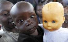A Congolese girl, displaced by recent fighting in North Kivu, holds a doll at the child friendly space (CFS) within Mugunga III camp for the internally displaced people near Goma, eastern Democratic Republic of Congo, August 7, 2013. PHOTO BY REUTERS/Thomas Mukoya