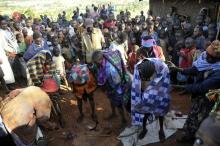 A fiile photo of people gathered around teenage girls who have just undergone female genital mutilation. PHOTO BY REUTERS/James Akena