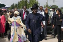 Nigeria's President Goodluck Jonathan (C) and wife waves to people in the queue waiting to cast their vote in Otuoke, Bayelsa State, March 28, 2015. PHOTO BY REUTERS/Afolabi Sotunde