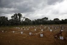 Graves of unidentified refugees and migrants who drowned at sea during an attempt to cross a part of the Aegean Sea from the Turkish coast are at a cemetery near the village Kato Tritos on the Greek island of Lesbos, February 4, 2016. PHOTO BY REUTERS/Giorgos Moutafis