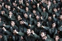 Iranian revolutionary guard corps chant slogans during Friday prayers in Tehran, May 26, 2006. PHOTO BY REUTERS/Raheb Homavandi