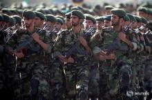 Members of Iran's Revolutionary Guards march during a military parade to commemorate the 1980-88 Iran-Iraq war in Tehran, September 22, 2007. PHOTO BY REUTERS/Morteza Nikoubazl