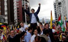 Guillermo Lasso, presidential candidate from the CREO party, greets supporters outside the electoral council headquarters, in Quito, Ecuador. PHOTO BY REUTERS/Henry Romero