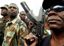 Guy Philippe, former police chief police, participates in a march into the city of Gonaives, Haiti, February 19, 2004. PHOTO BY REUTERS/Daniel Aguilar