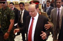Yemen's President Abd-Rabbu Mansour Hadi enters the hall during the closing ceremony of the Yemeni national dialogue conference in Sanaa