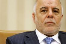 Iraq's Prime Minister Haider al-Abadi listens to remarks to reporters by U.S. President Barack Obama after their bilateral meeting in the Oval Office at the White House in Washington, April 14, 2015. PHOTO BY REUTERS/Jonathan Ernst