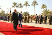 Iraq's Prime Minister Haider al-Abadi and his Turkish counterpart Binali Yildirim review a guard of honour during a welcoming ceremony in Baghdad, Iraq, January 7, 2017. PHOTO BY REUTERS/Hakan Goktepe/Prime Minister's Press Office
